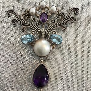 Elegant Sterling Silver Pendant With Amethyst, Blue Topaz, and Mabe Pearl Stones